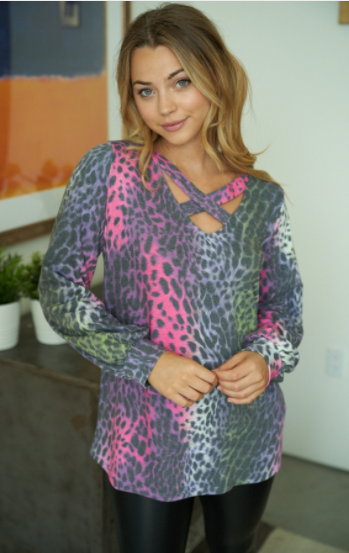097 A long sleeve leopard print knit top with a v-neck featuring a criss cross detail and a puff sleeve. Fabric is soft and comfortable T22109A2XL