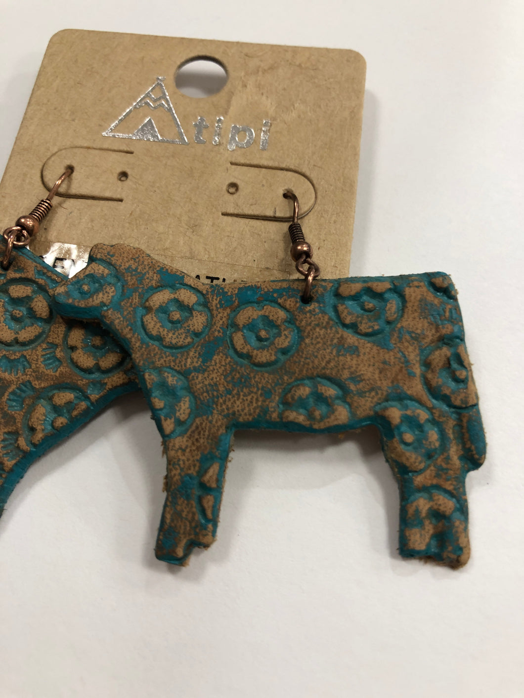 Turquoise tooled leather cow earrings