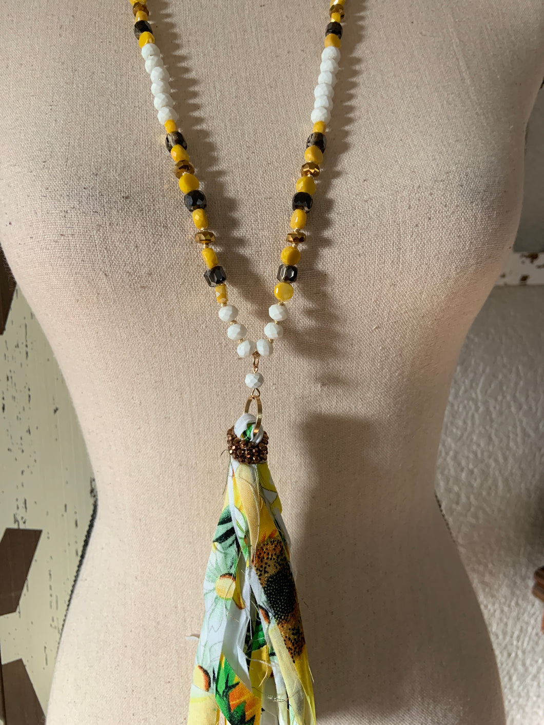 Sunflower tassel with white and yellow beads