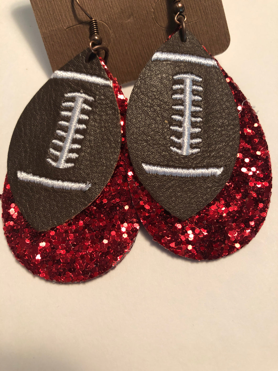 Earrings red bling football