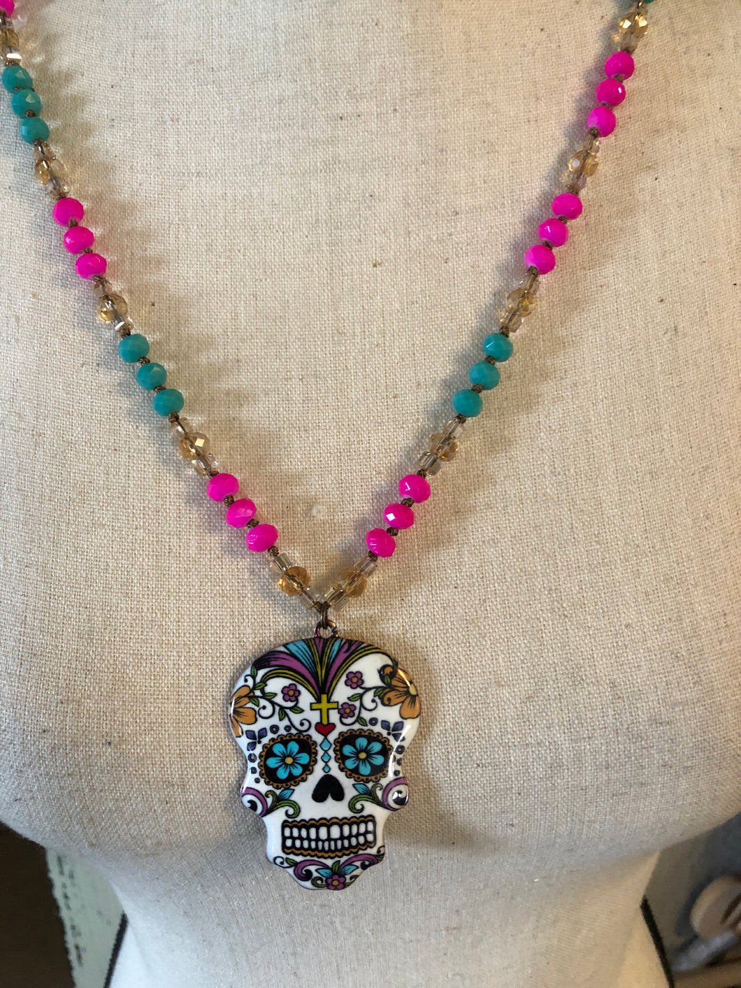 Sugar skull metal necklace with pink and mint beard