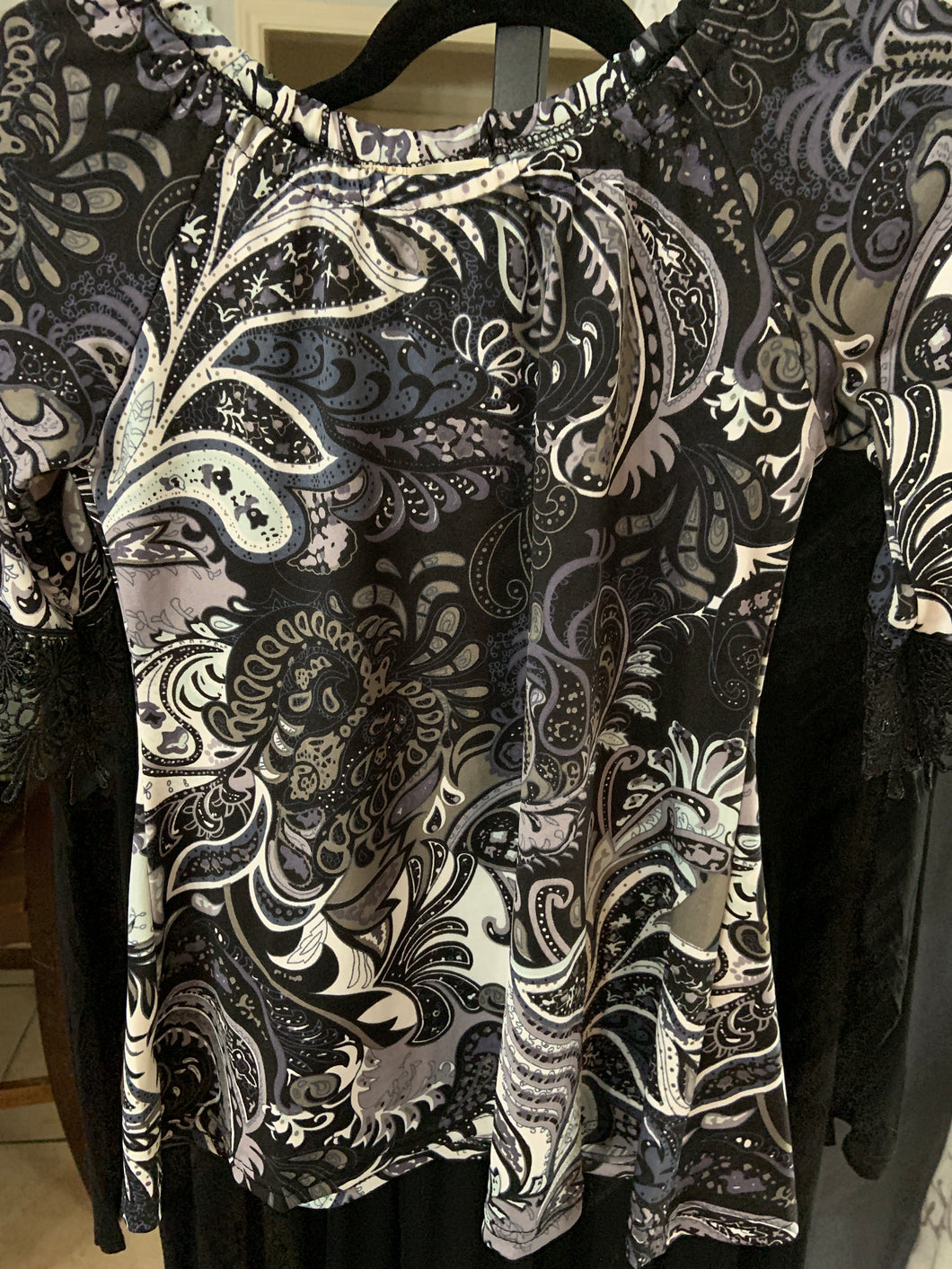 Kids address crocheted sleeve black background Paisley