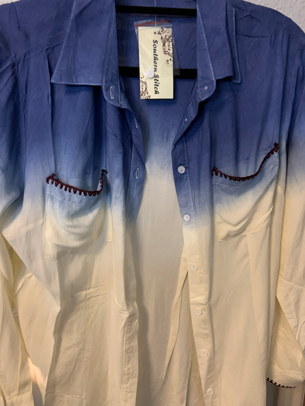 Cream top with blue and pockets