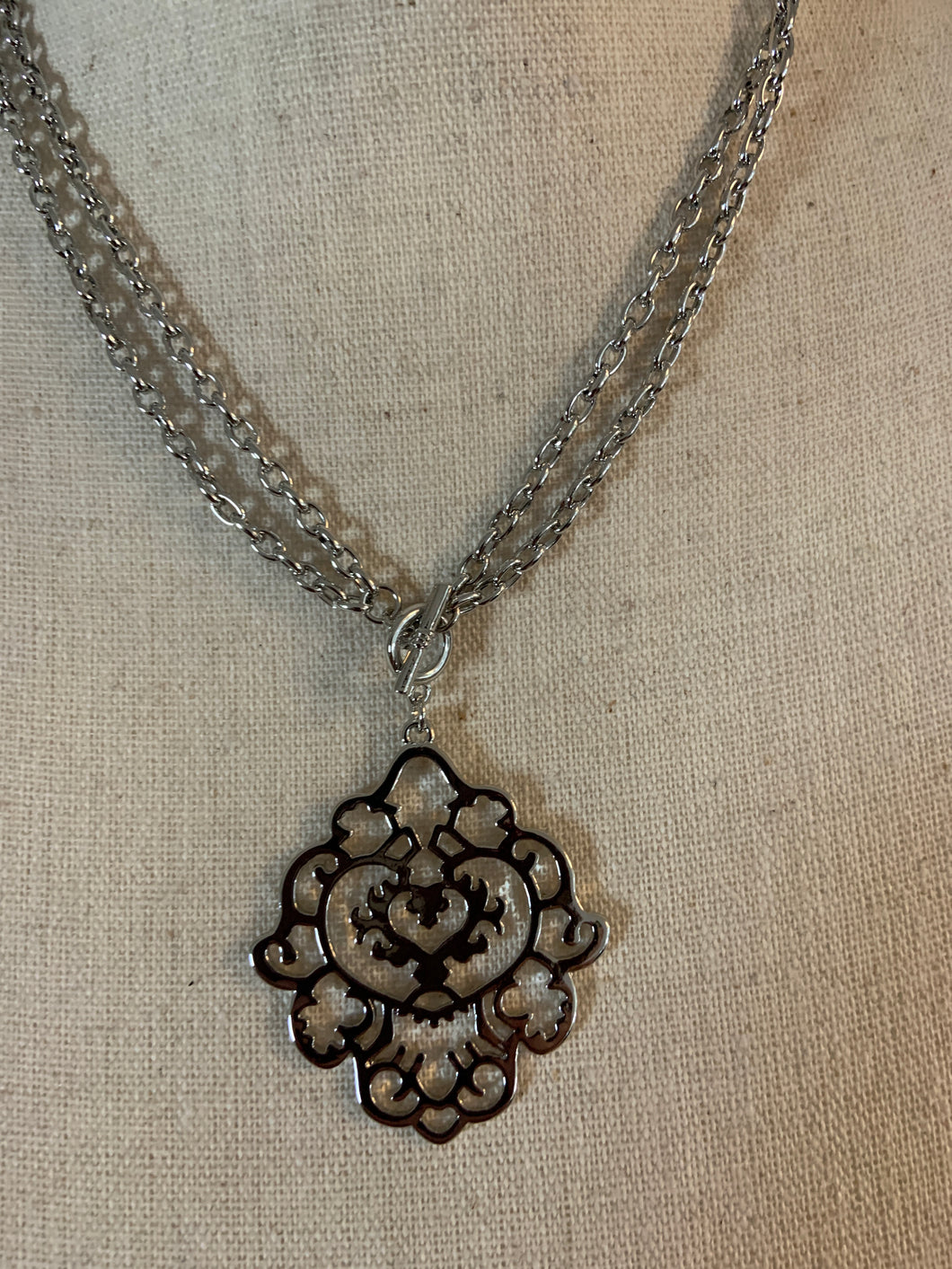 Scroll necklace with loop hook