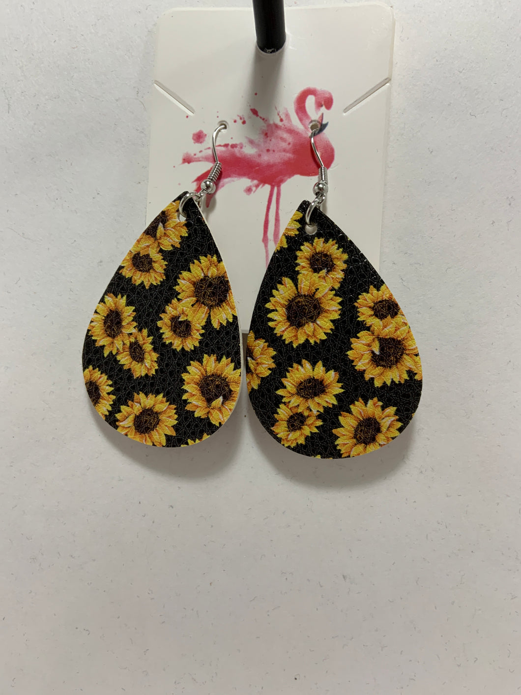 Sunflower earrings with black background