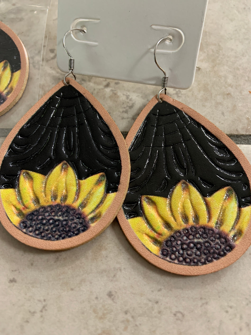 Leather teardrop earrings with embossed sunflower