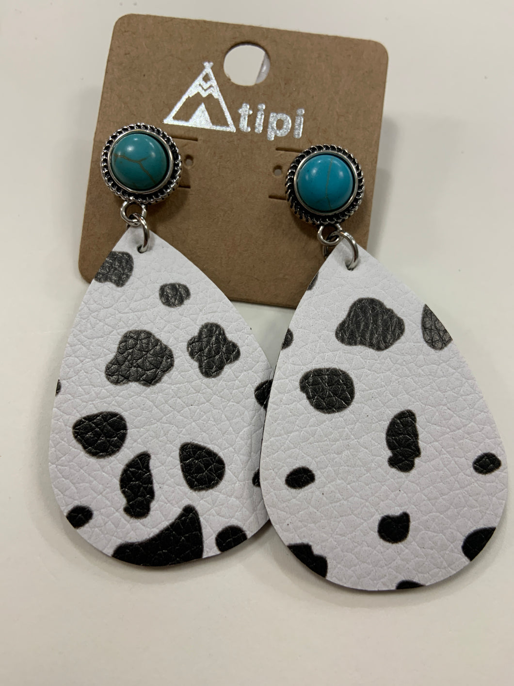 Studded earrings with turquoise and Cow