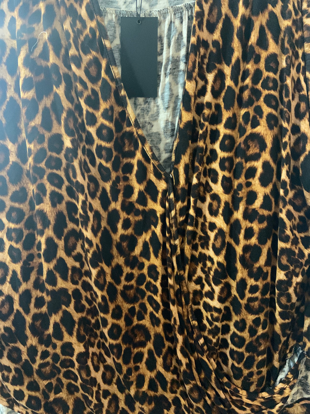 Cheetah top with one button inside open