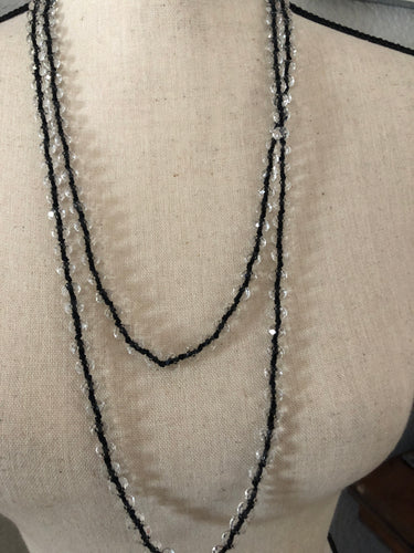 Beads clear beads stung on black cording